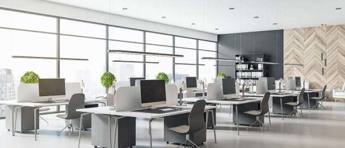 Eco style interior design in modern open space office with grey tables and chairs, wooden decor wall and concrete floor